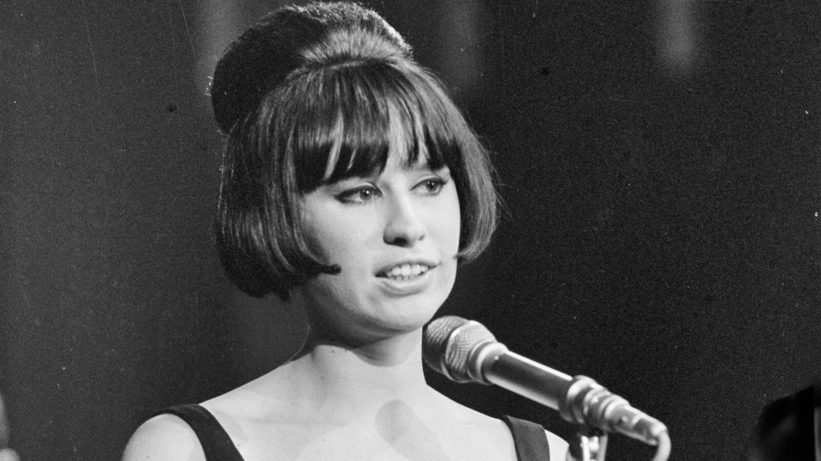 Astrud Gilberto at a microphone