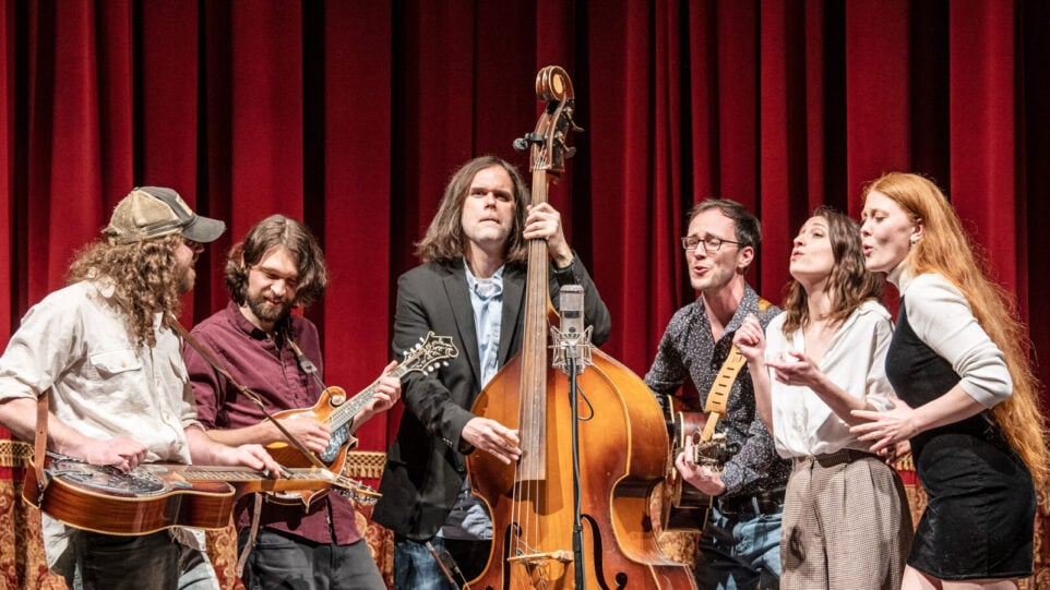 six-person string band performing on stage