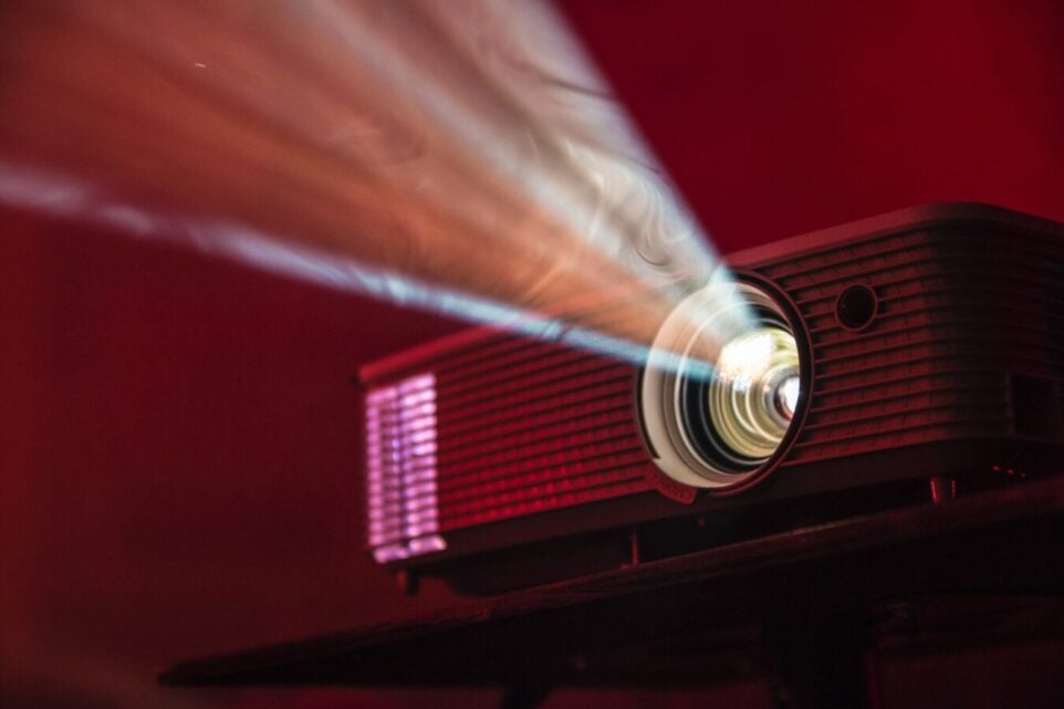 projector in red light, projecting light