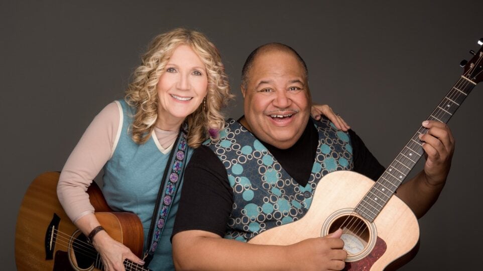 woman and man with guitars