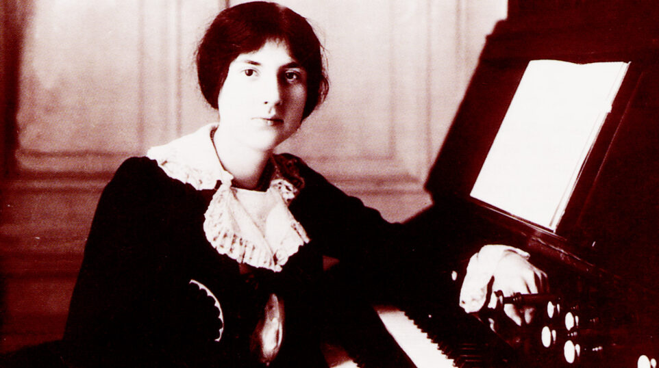 A young Lili Boulanger sits at the organ