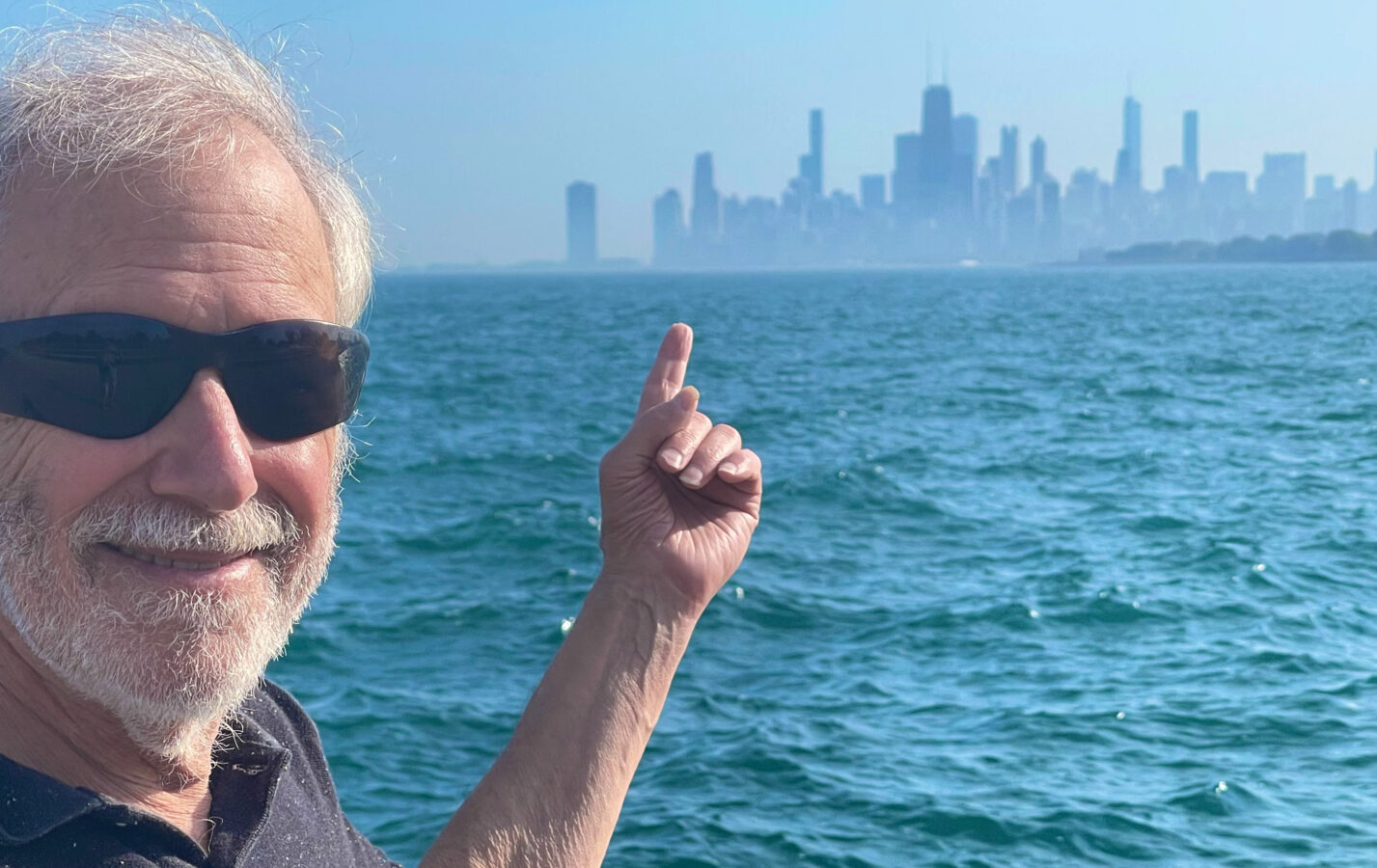 Corky Siegel poses with the Chicago Skyline