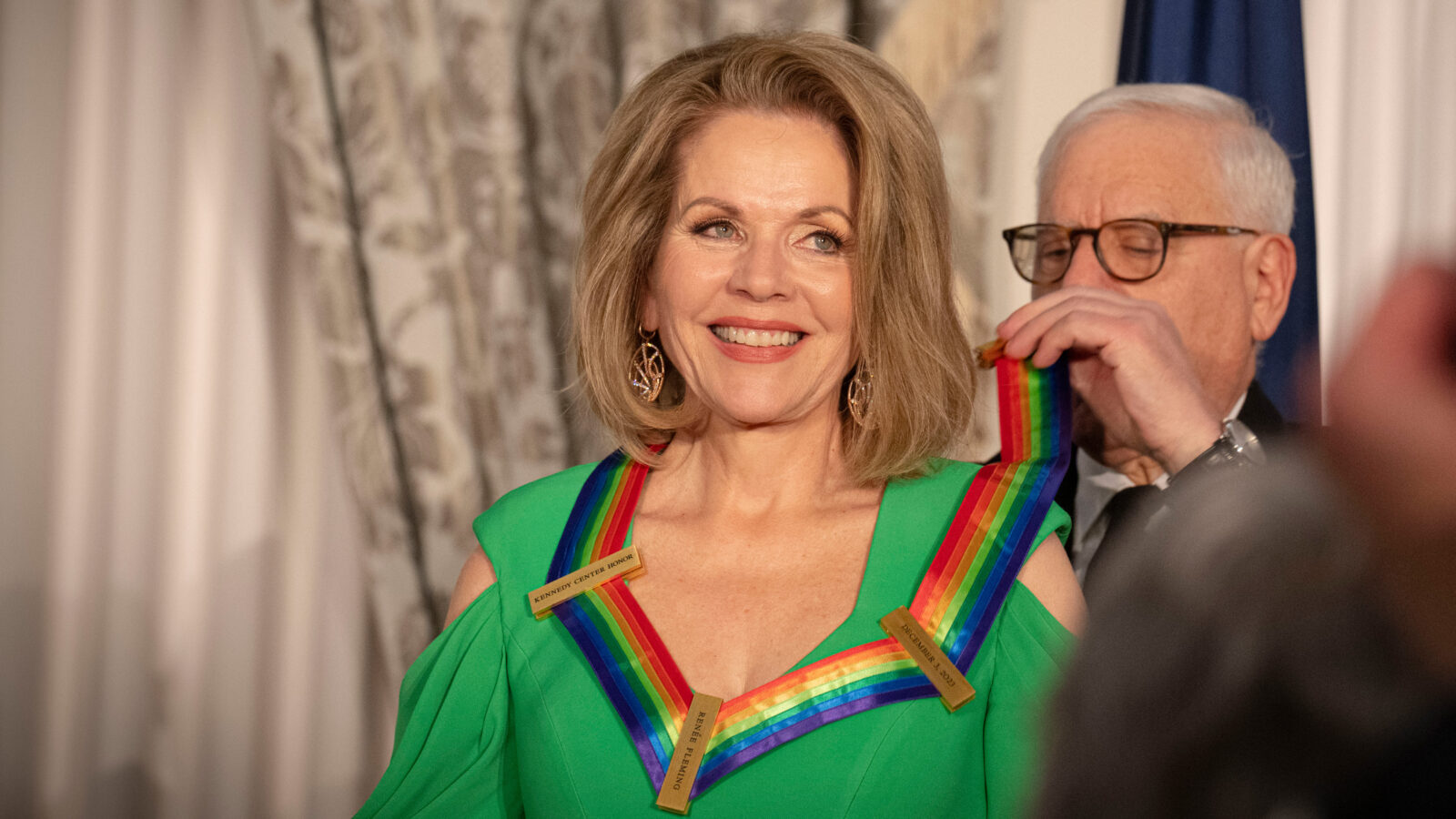 Renée Fleming beams as she receives a Kennedy Center Honor sash