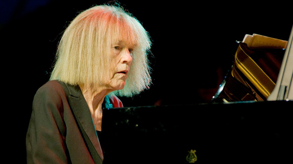 Carla Bley performing at the piano