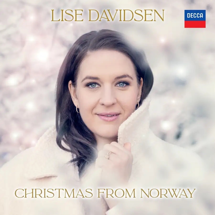 Album cover for 'Christmas from Norway', showing Lise Davidsen in a white winter coat in front of a glowing snow background