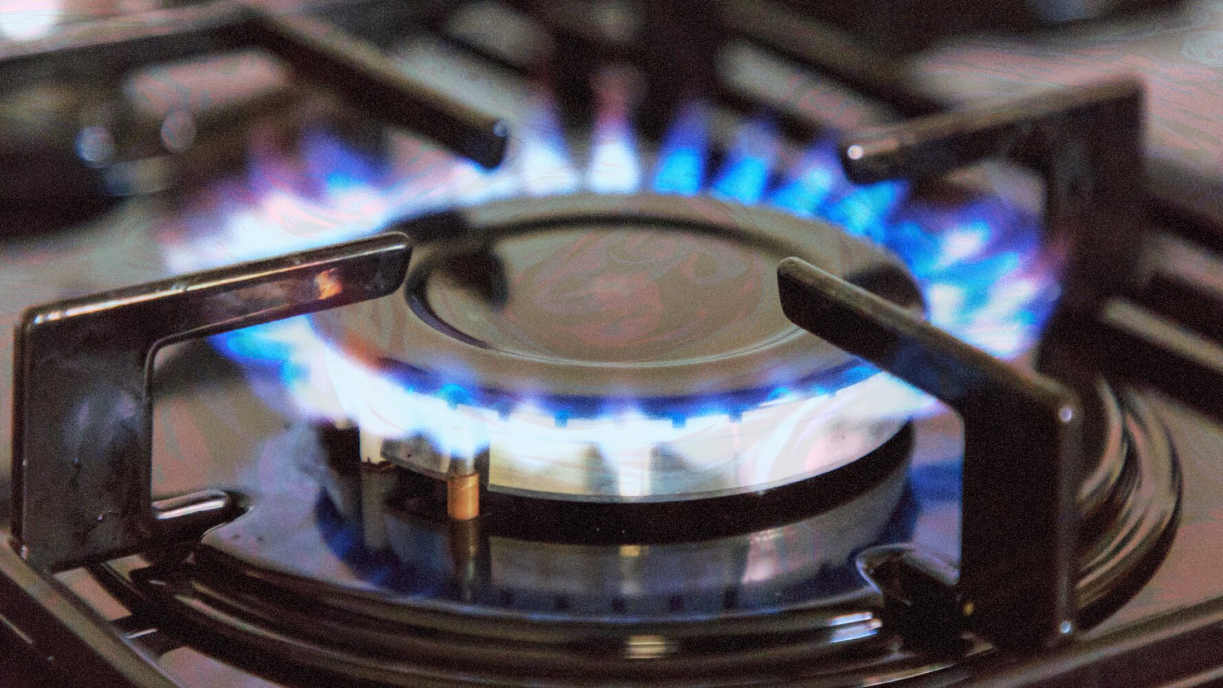 a brightly lit stove burner