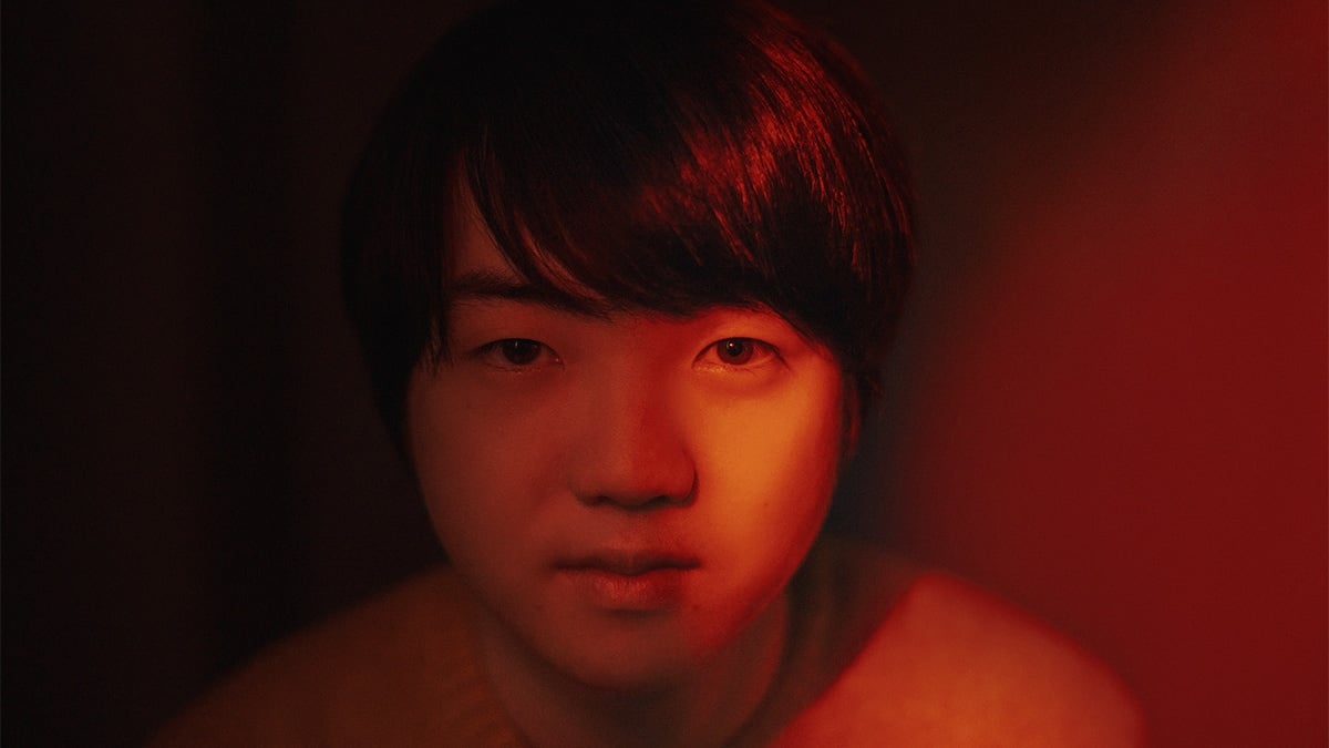 Red tinged closeup portrait of Mao Fujita