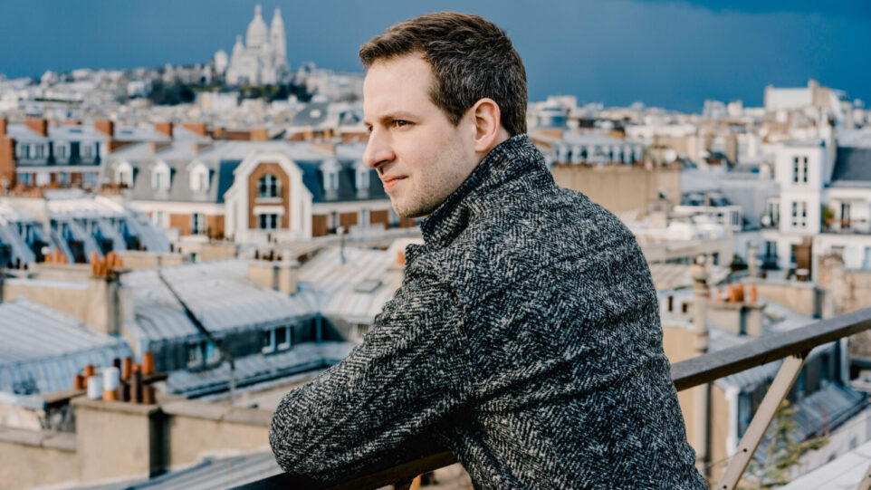 Bertrand Chamayou overlooks a city pensively