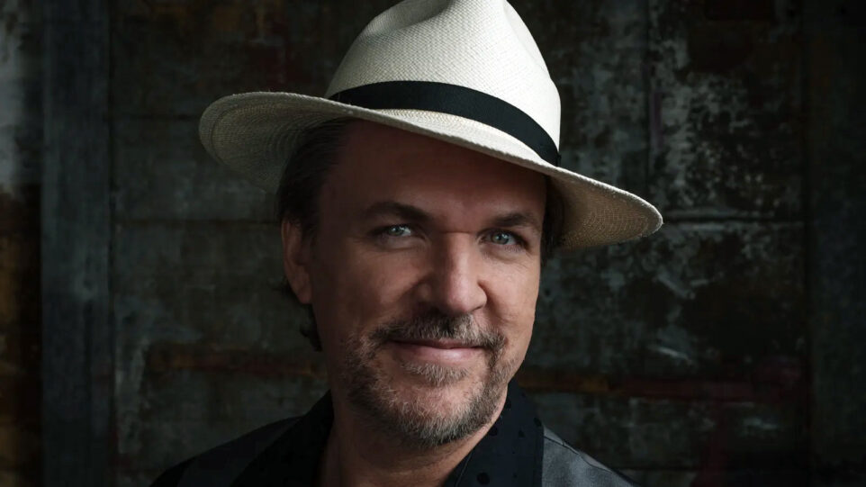Mark O'Connor wears a white hat and a polka dot dark shirt