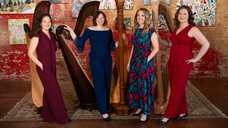 Chicago Harp Quartet musicians pose with their instruments