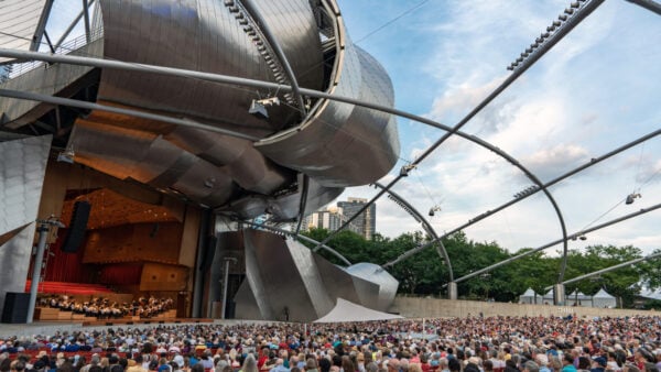 the GRant Park Orchestra performs on the striking Pritzker Pavilion stage to a full audience