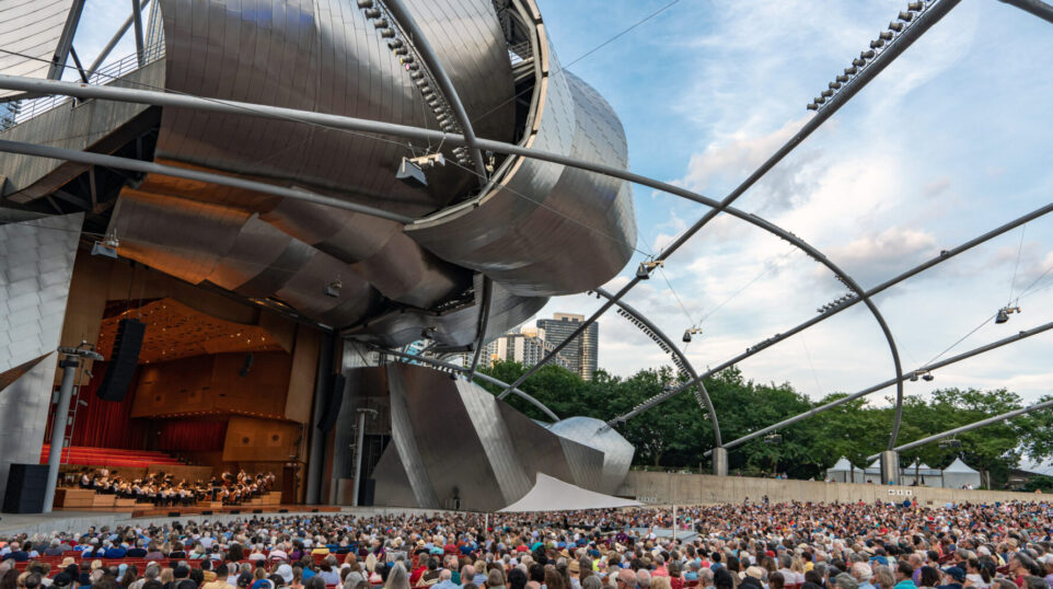 the GRant Park Orchestra performs on the striking Pritzker Pavilion stage to a full audience