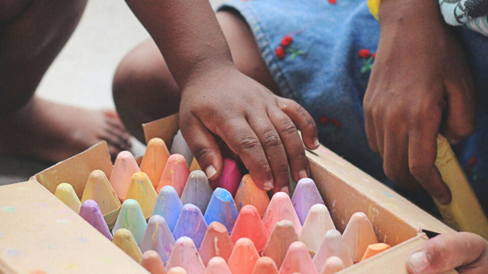A Child playing with side walk chalk