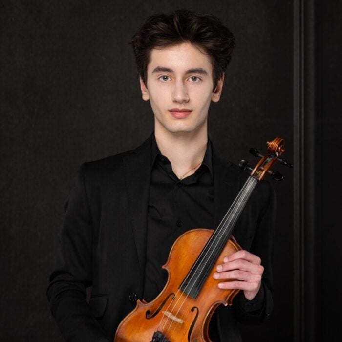 Portrait of Javier Irizarry holding violin