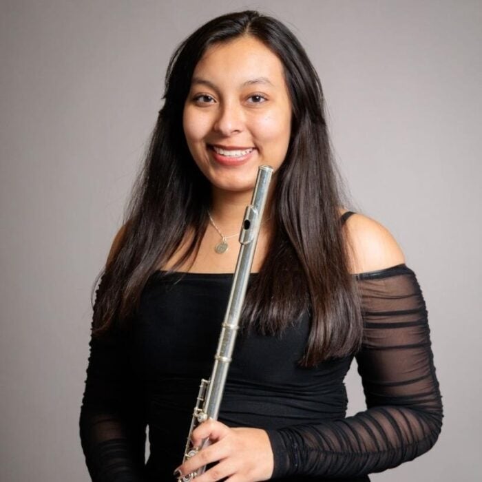 Portrait of Sofia Villanueva holding flute