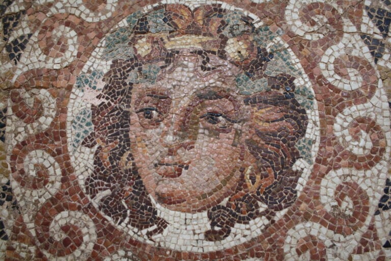 a mosaic of a young man with flowing hair