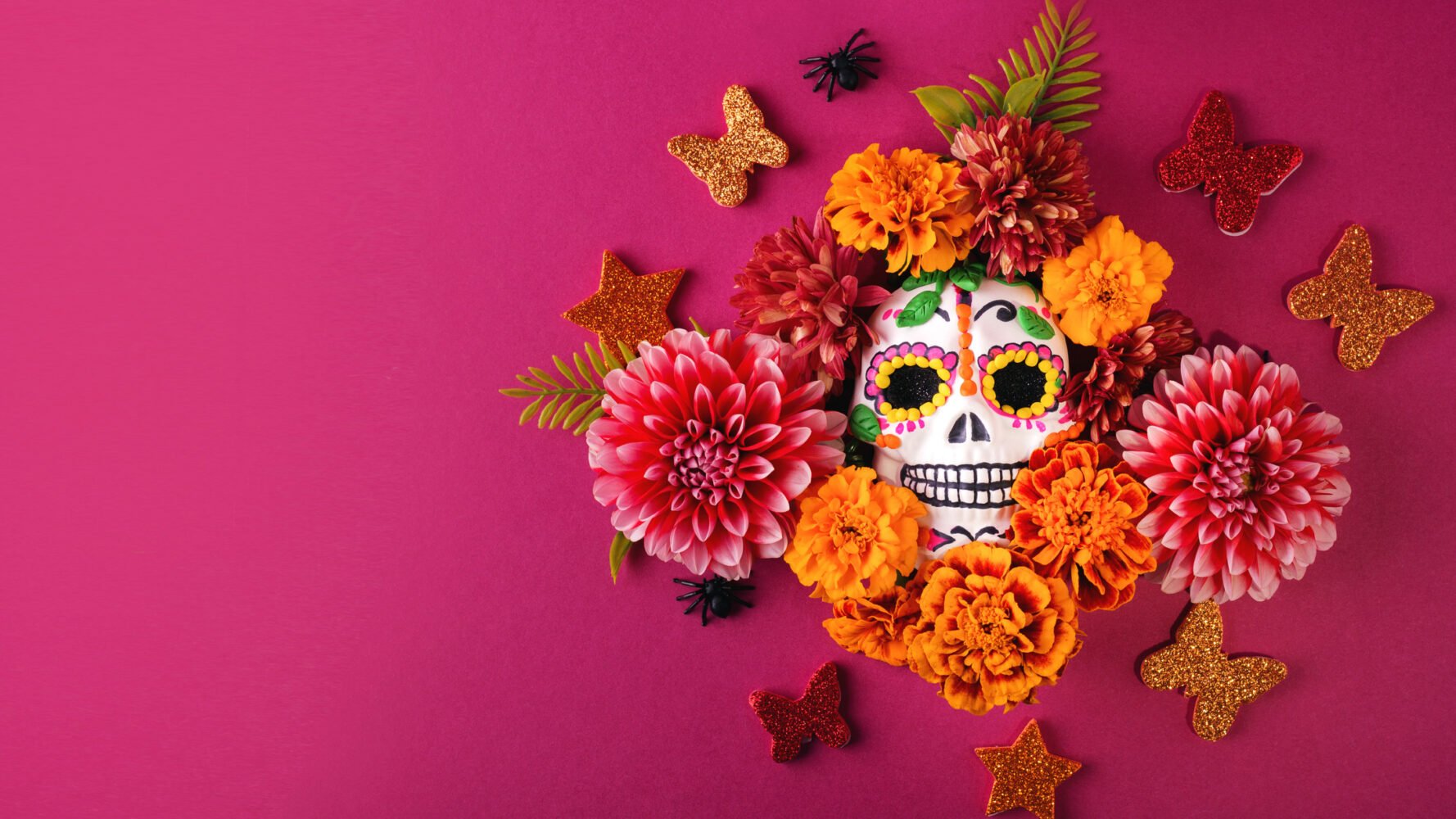 Dia de los muertos decorations: decorated skull with flowers