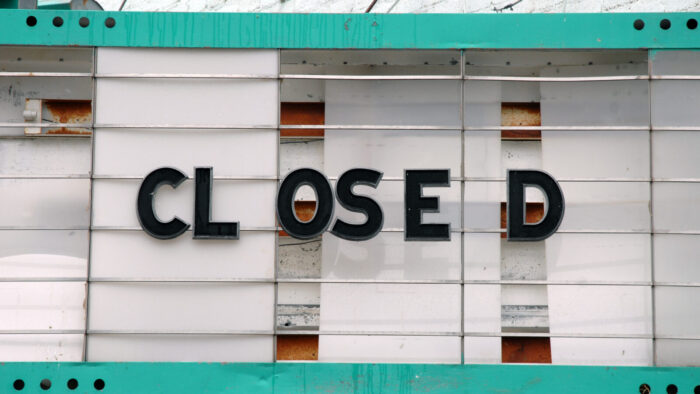 rundown marquee with text "Closed"