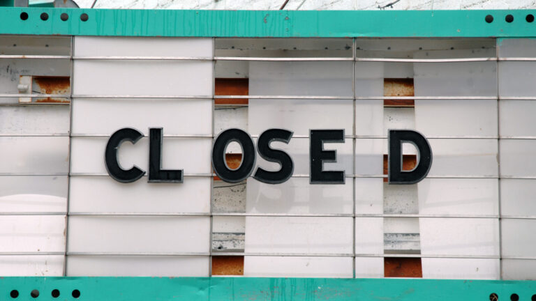 rundown marquee with text "Closed"