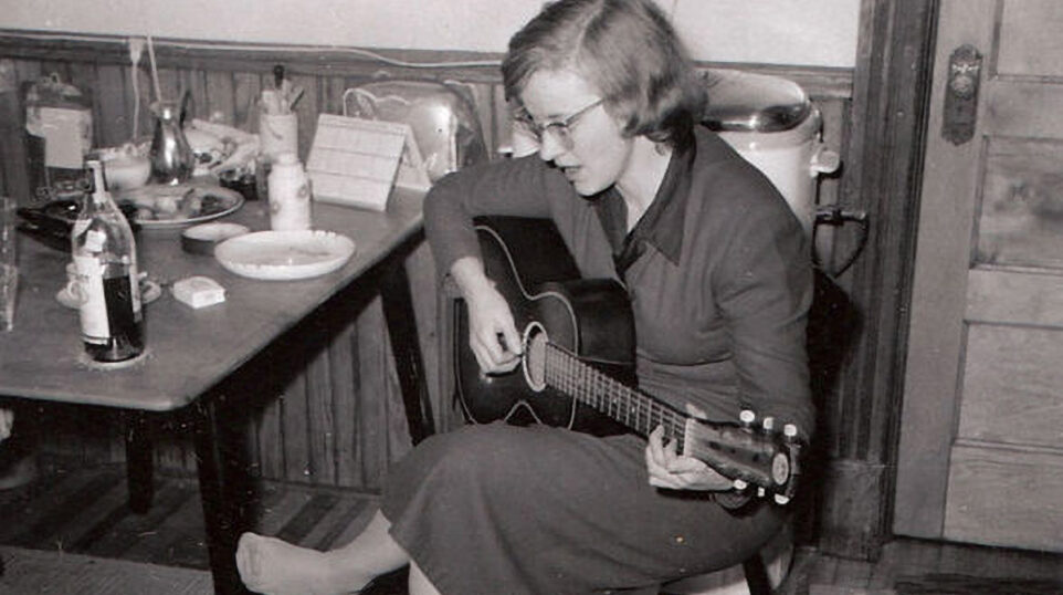 Connie Converse playing guitar