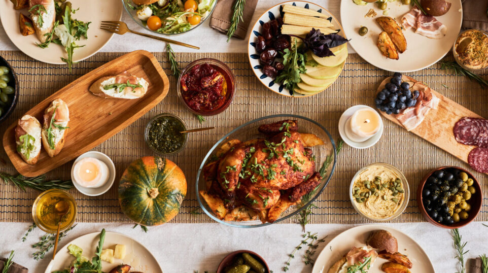 Thanksgiving feast spread with lots of side dishes