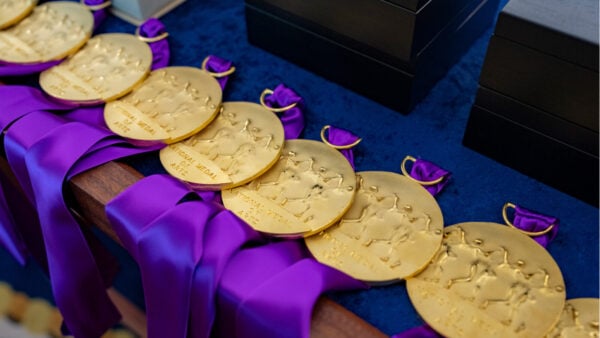 President Biden Awards Chicago Arts, Journalism Champion Bruce Sagan the National Medal of the Arts medals with purple ribbons