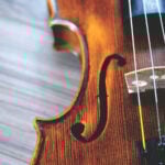 Close up photo of a violin on its back