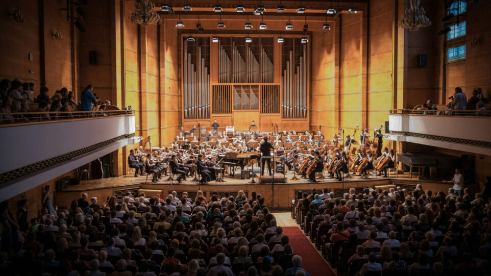 Beautiful Photo of an Orchestra in a Hall about to play