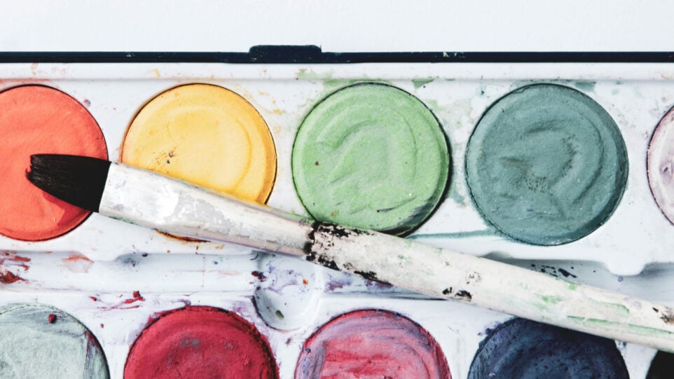 Paints in a palette with a Brush