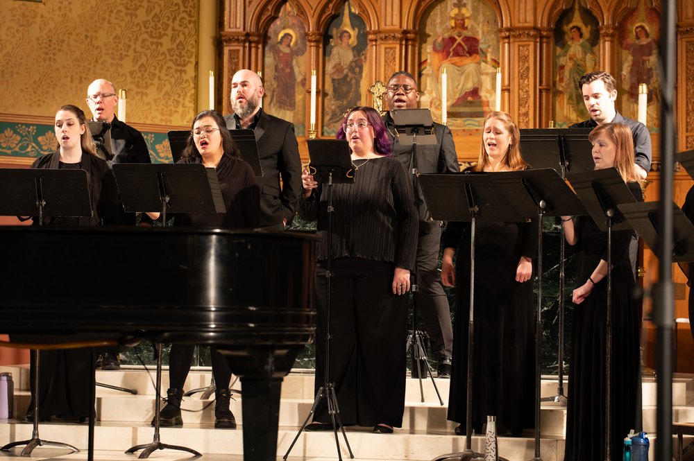 Members of William Ferris Chorale performing in concert at a church