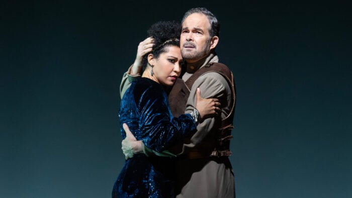 Man and woman in a passionate but tense embrace