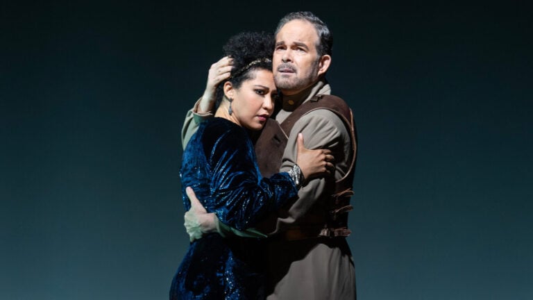 Man and woman in a passionate but tense embrace