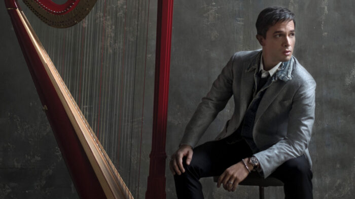 man with red harp
