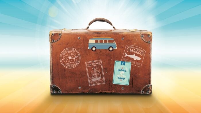 old suitcase with sunburst behind it