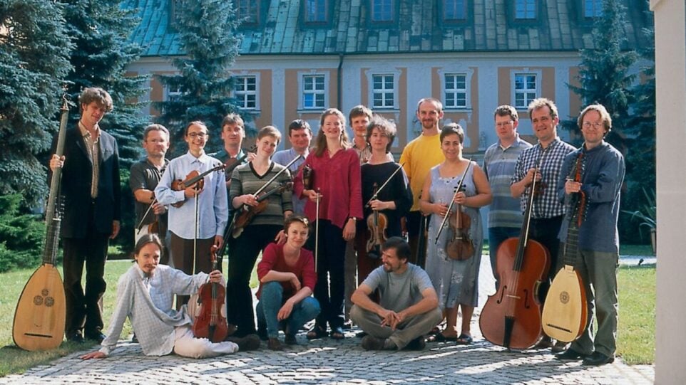 a young group of 17 women and men, each holding instruments popular in the 15-18th centuries