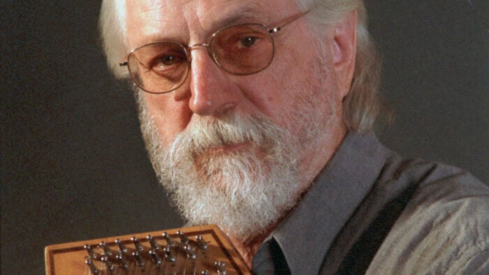 bearded man looks into camera