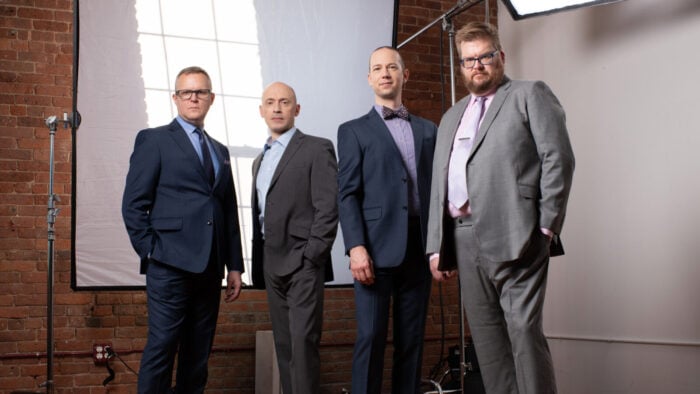 Four men posing