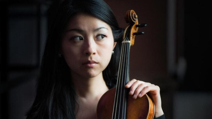 woman holding violin