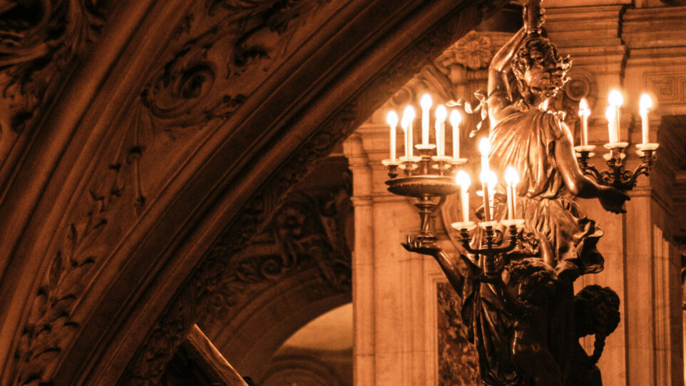 A person holding a candelabra in an Opera House