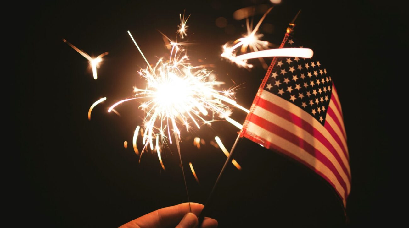 A sparkler and an American flag