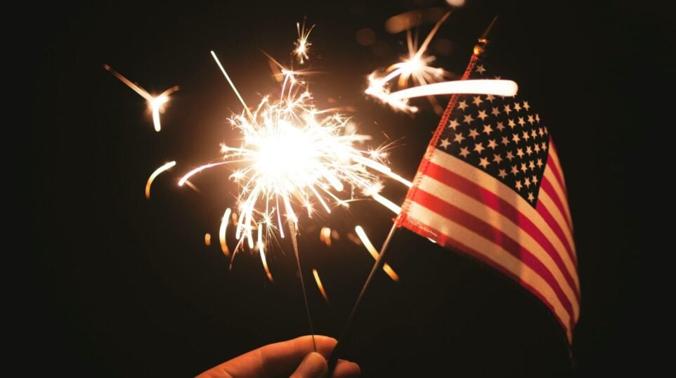 A sparkler and an American flag