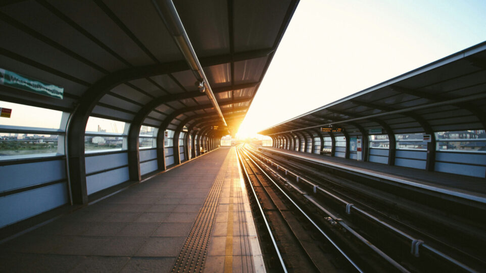Basic Train Station looking into the sunset and down the tracks that follow into the sunset