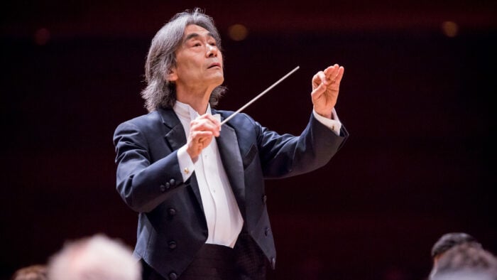 Man in white tie and tails conducting