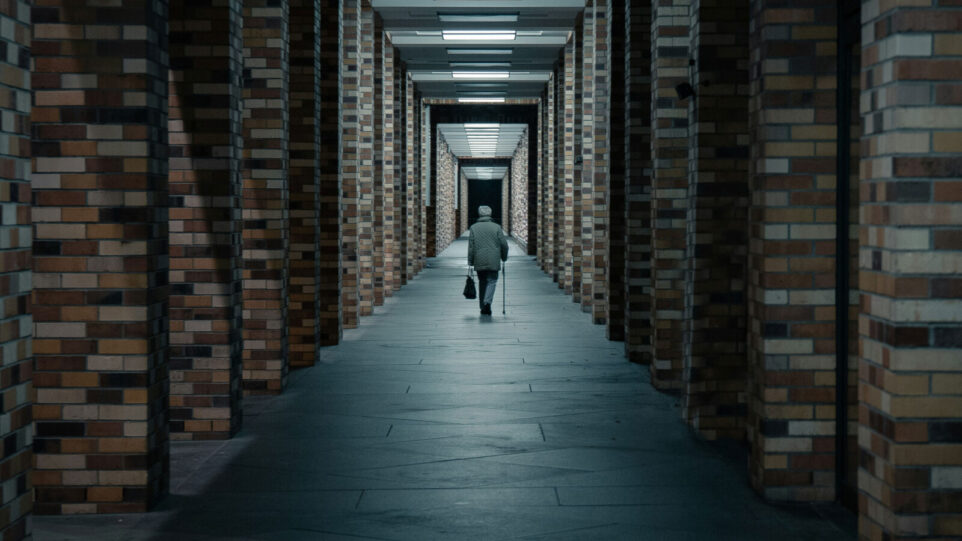 A man walking down a corridor