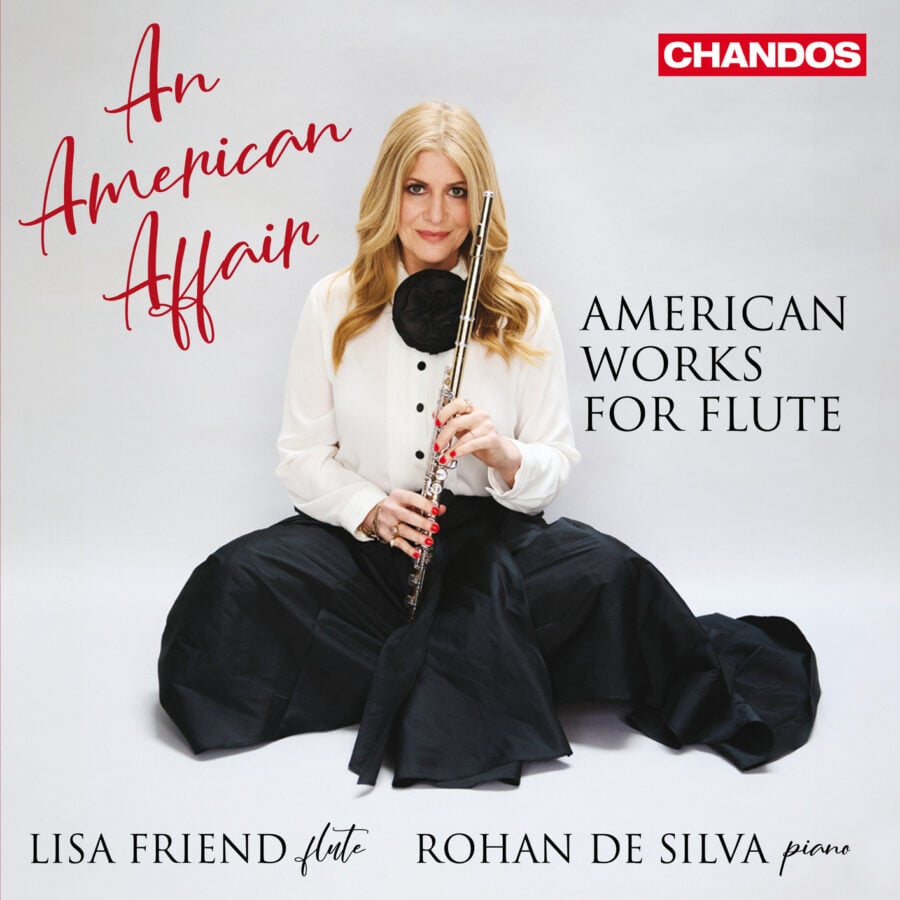 woman holding flute in front of whitebackground