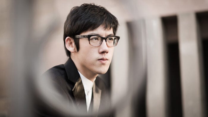Serious looking young man staring into distance