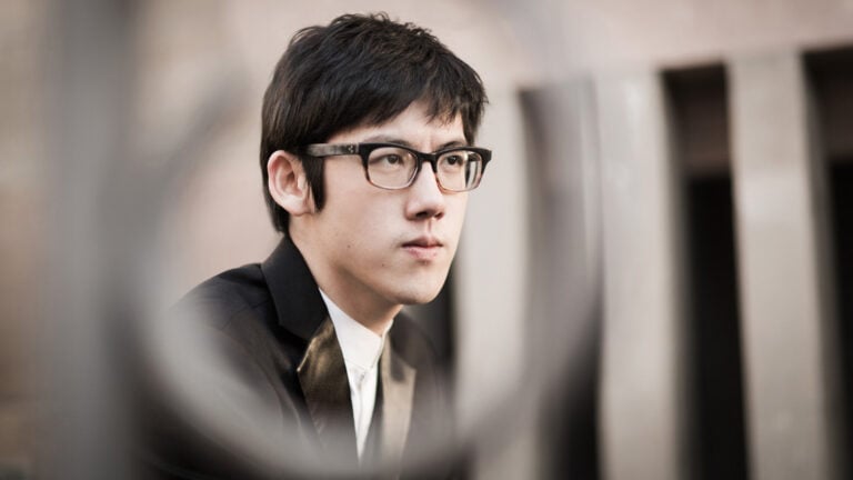 Serious looking young man staring into distance