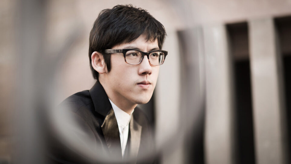 Serious looking young man staring into distance