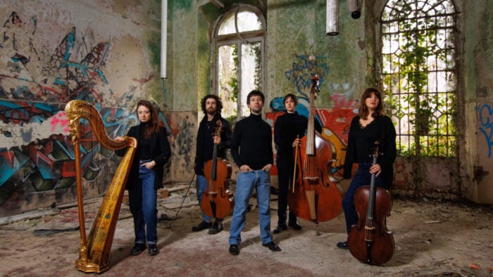 Musicians standing in rustic urban setting5