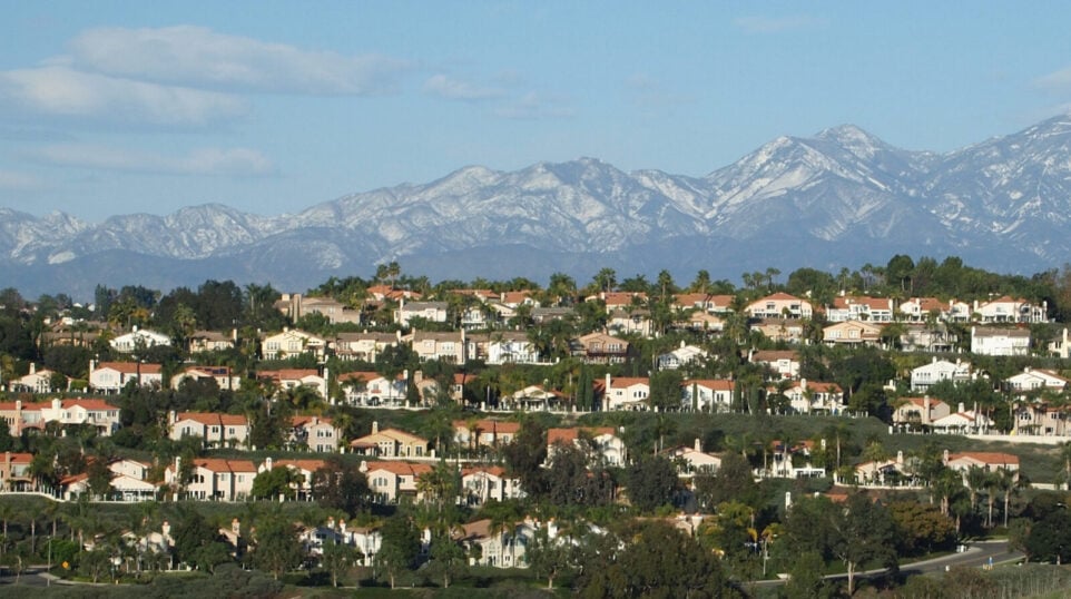 rows of suburban homes with mountains in background